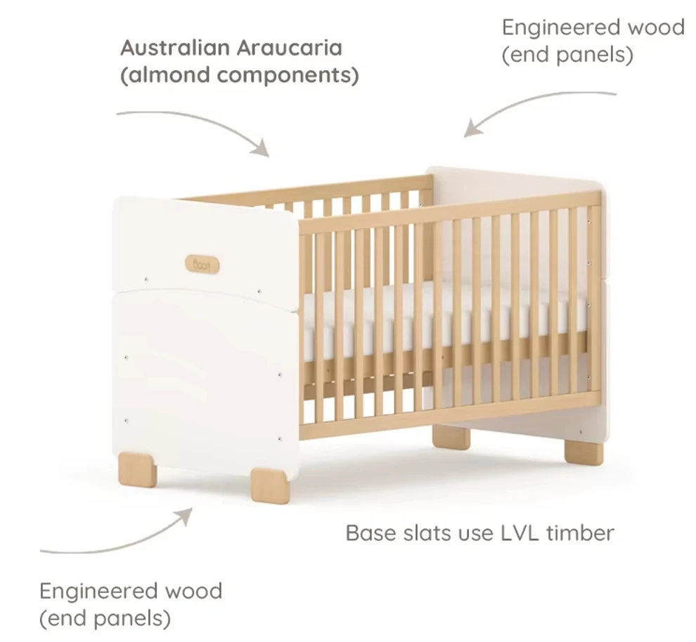 Modern Scandinavian-style wooden cot bed in baby cot mode, with round corners and angled feet Modern Scandinavian-style wooden cot bed in baby cot mode, with round corners and angled feet