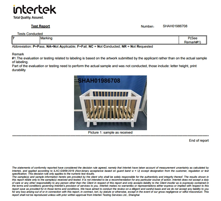 Intertek test report page showing the marking assessment and a photo of the white cot bed sample as received Intertek test report page showing the marking assessment and a photo of the white cot bed sample as received