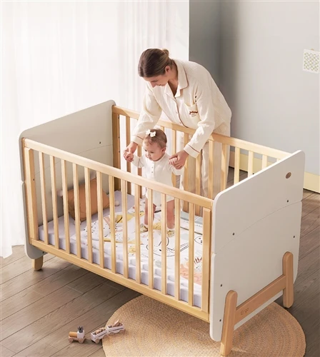 A Wooden Baby Cot With Slatted Sides, Two Base Heights and a Toddler-Bed Form